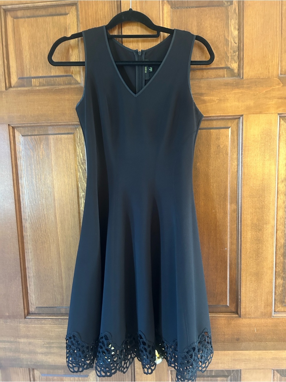 Sleeveless Black Fit-and-Flare Dress with Laser-Cut Hem